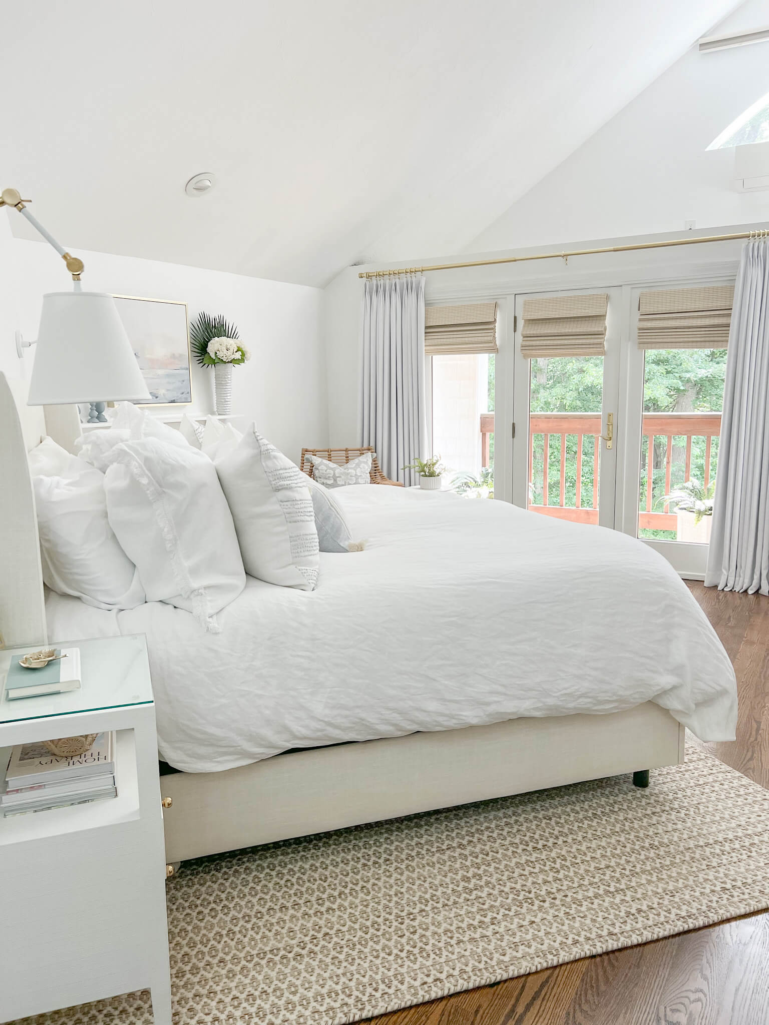Upholstered Bed with Textured Jute Rug and Monochromatic