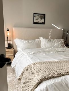 Upholstered Panel Bed featuring Chunky Knit Texture and Rattan Table