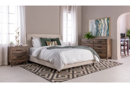 Upholstered Panel Bed with Geometric Rug and Tan Fabric Base