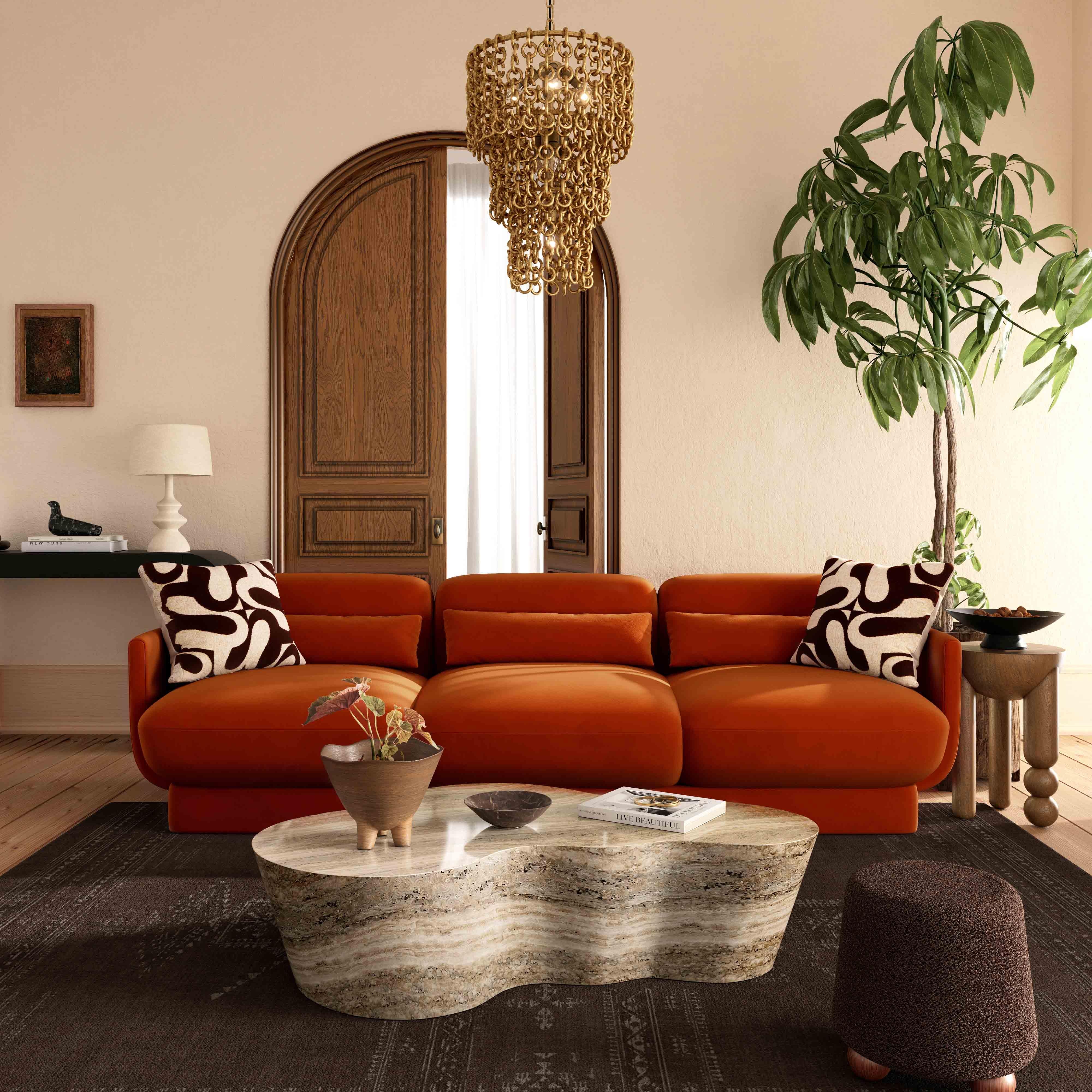 Velvet Sofa: Burnt Orange and Wavy Travertine Stone Table