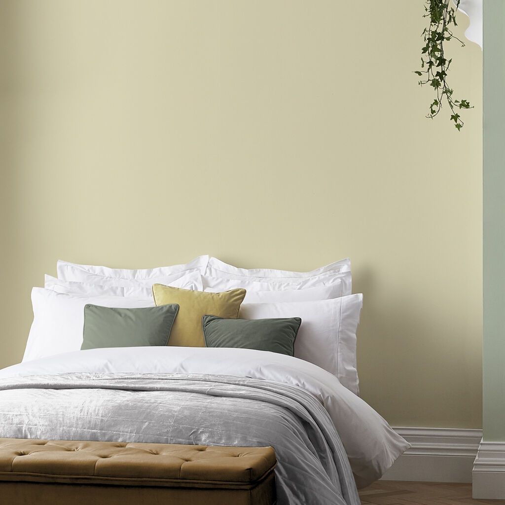 Wall Paint featuring Sand Yellow Walls and Sage Accent Pillows