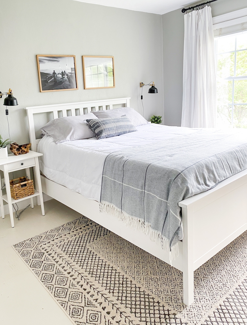 White Platform Bed featuring Slatted Headboard and Swing Arm Sconces