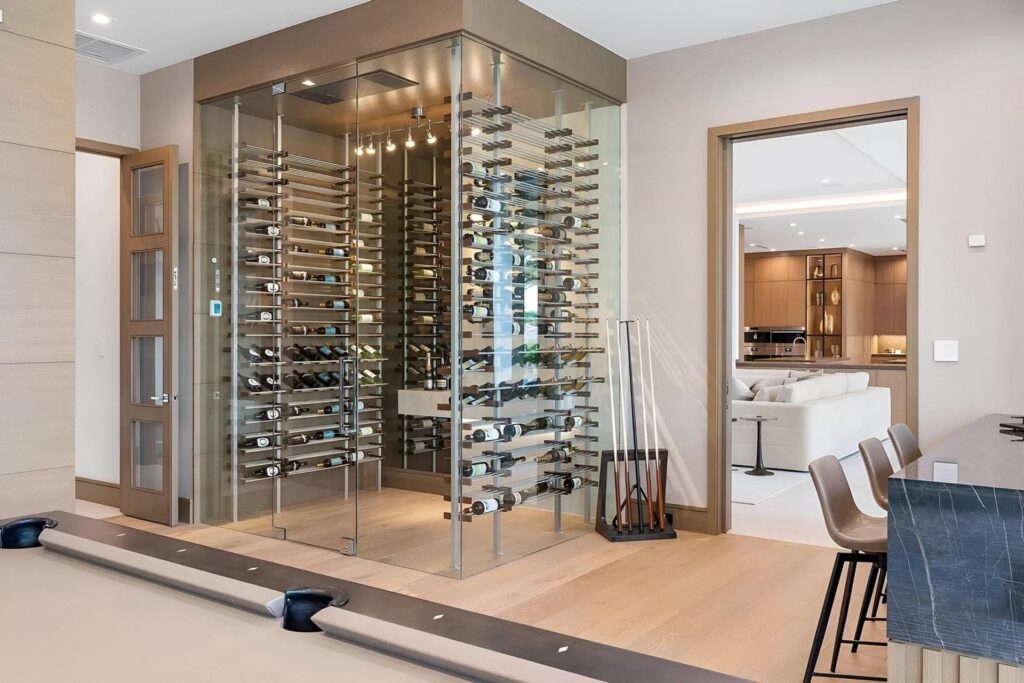 Wine Cellar with Metal Post System and Glass Wine Wall Design