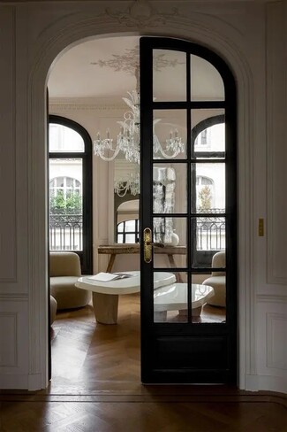 Arched French Door: Dark Metal Frame Parisian Design