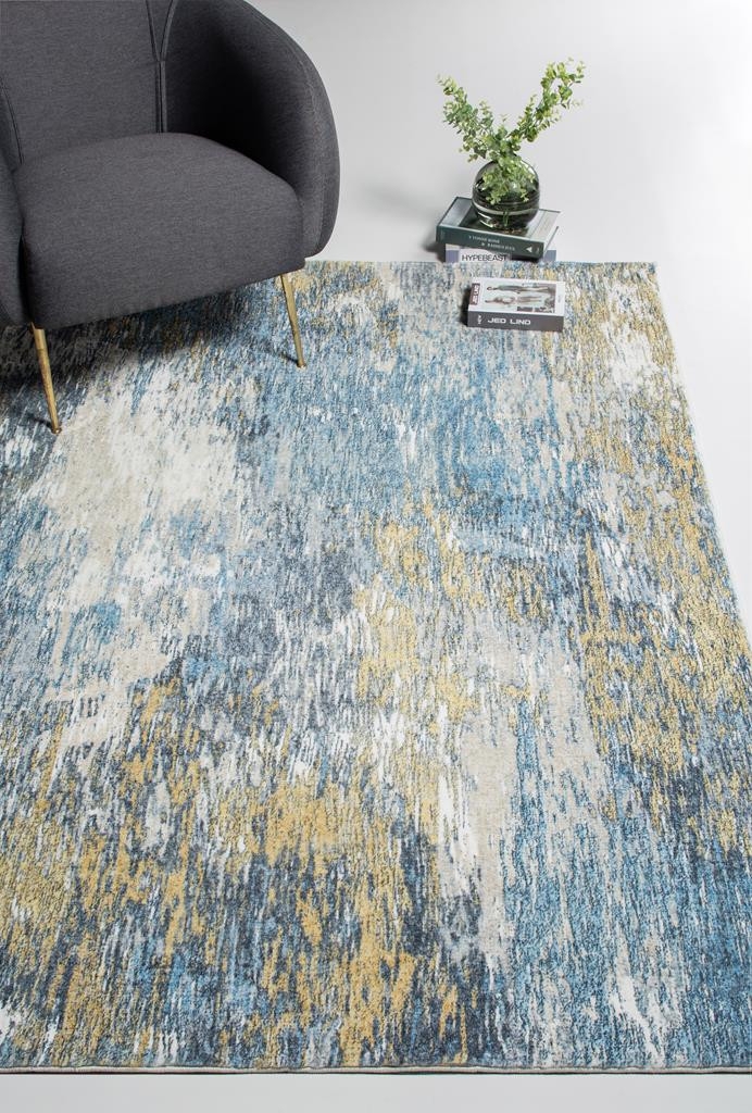 Area Rug with Blue Gold Abstract Mirage Pattern