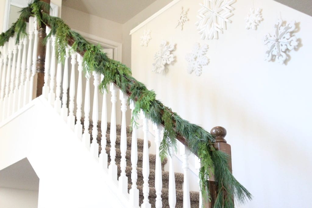 Banister Garland with White Snowflake Wall Decor and Greenery