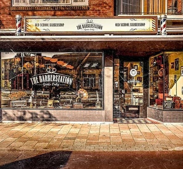 Barbershop Exterior with Barber Poles and Old School Signage