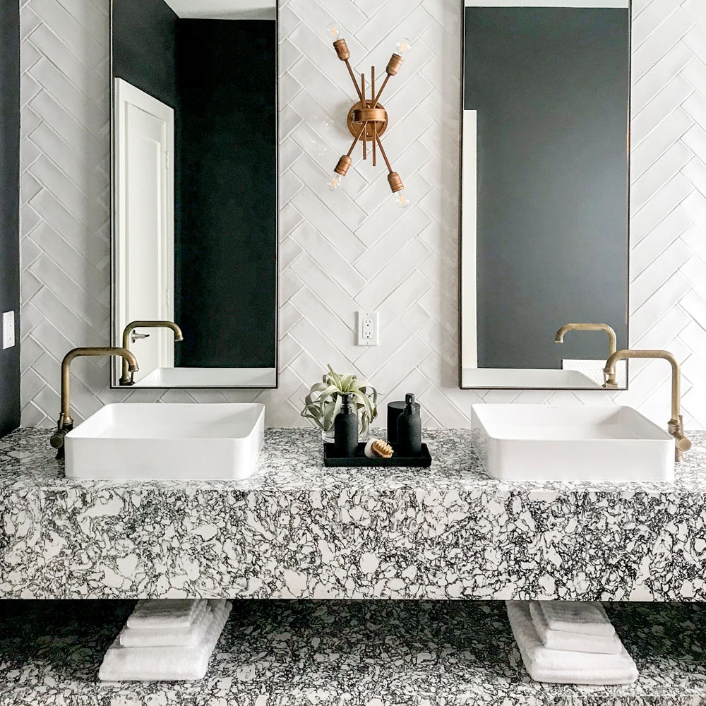 Bathroom Vanity showcasing Heavily Veined Stone and Vessel Sinks