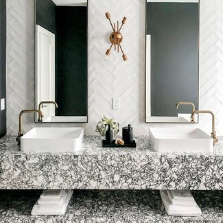 Bathroom Vanity showcasing Heavily Veined Stone and Vessel Sinks