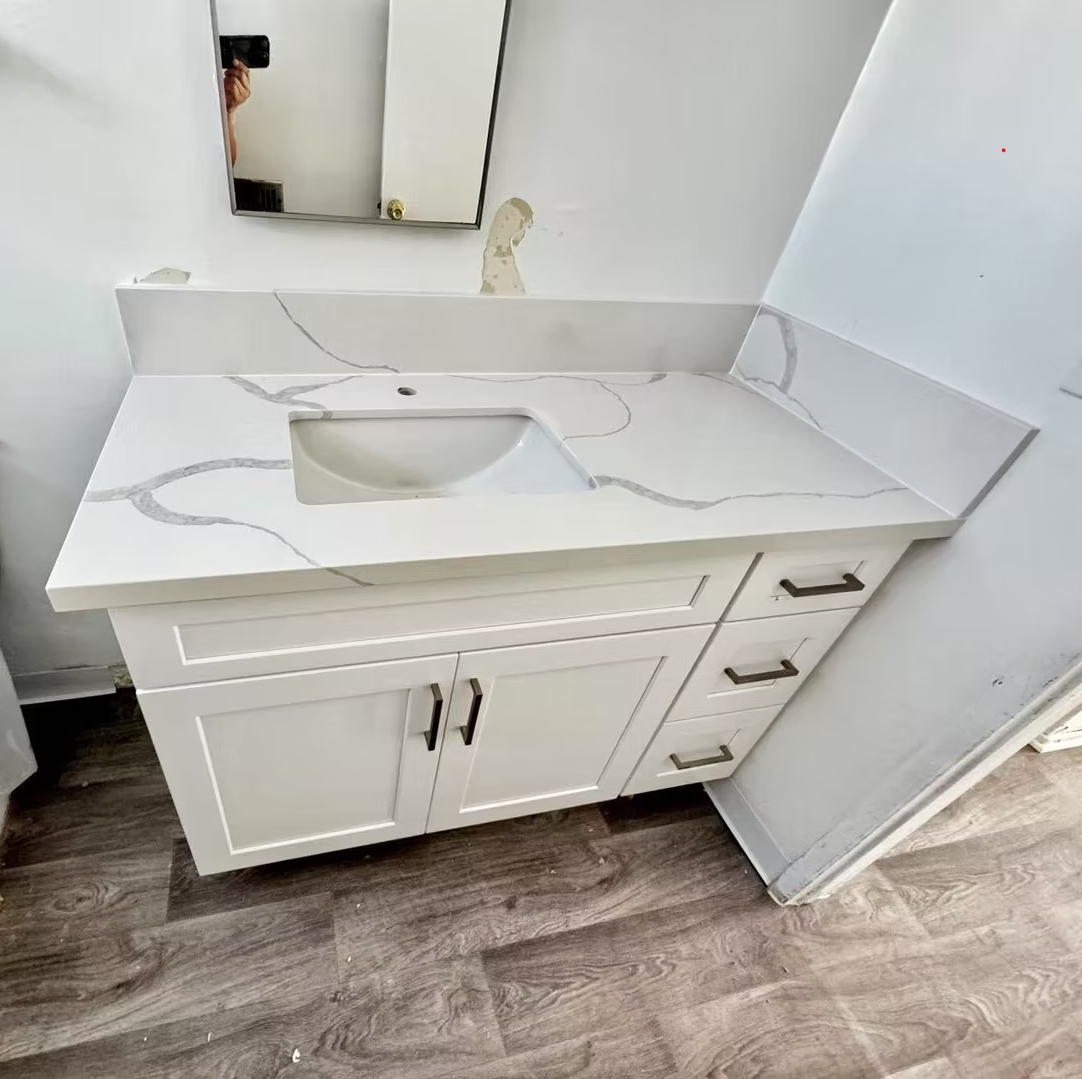 Bathroom Vanity showing Bold Veining and White Shaker Panel