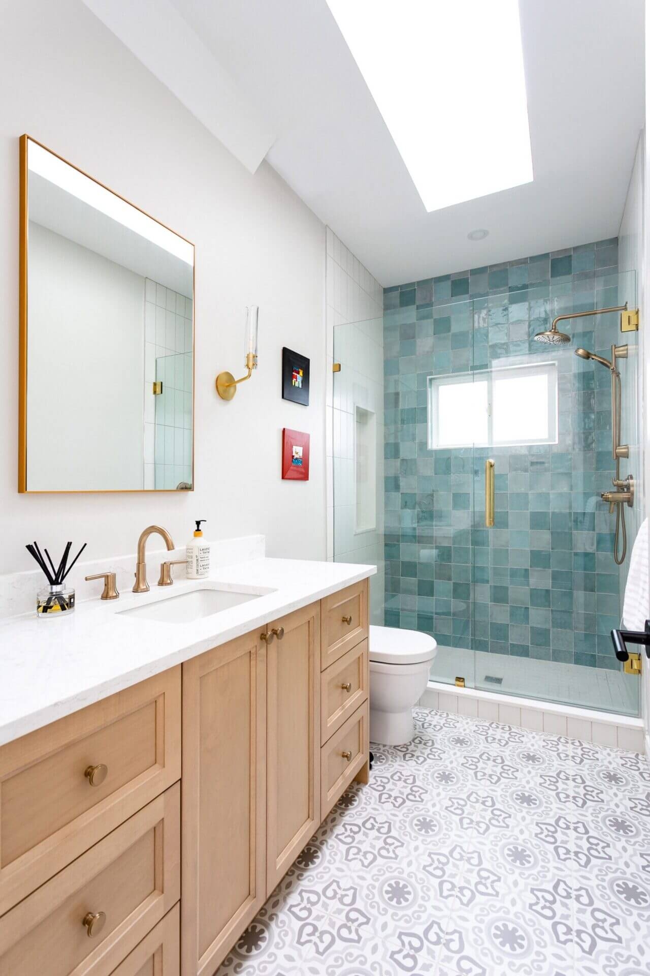 Bathroom Vanity with Teal Accent Wall and Geometric Floor