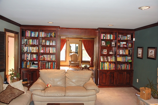 Built-In Bookcase: Mahogany Doorway Framing Wall Unit