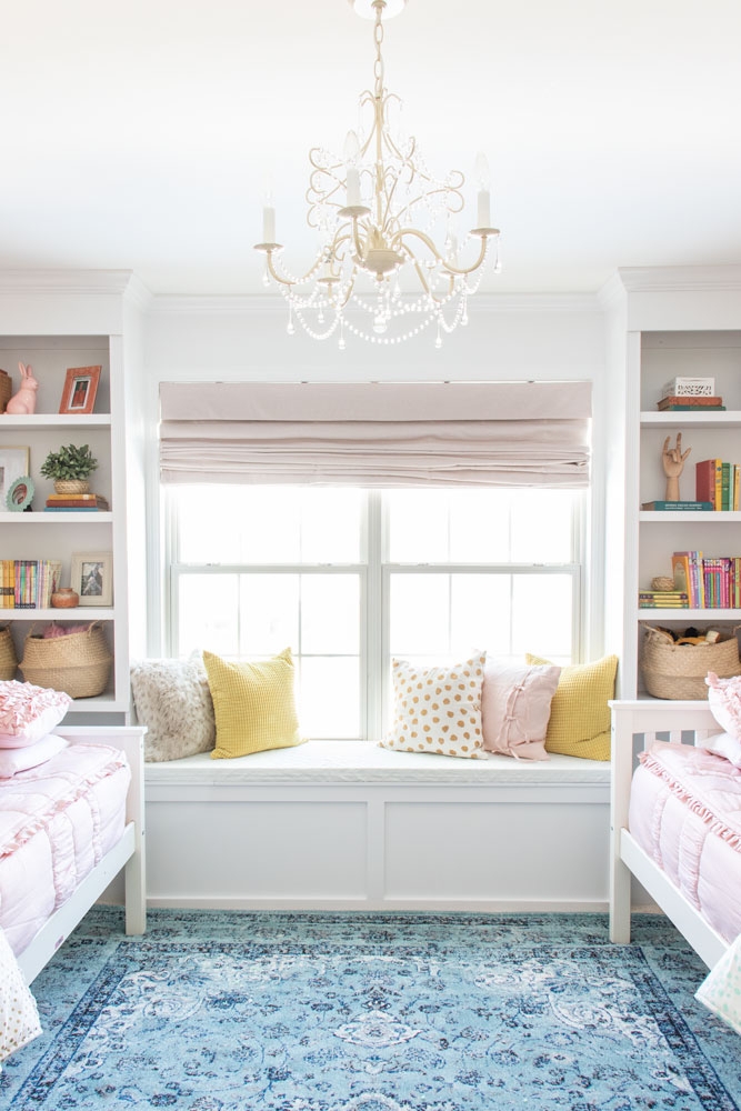 Built-In Bookcase Symmetrical Ornate Chandelier Nursery Lighting