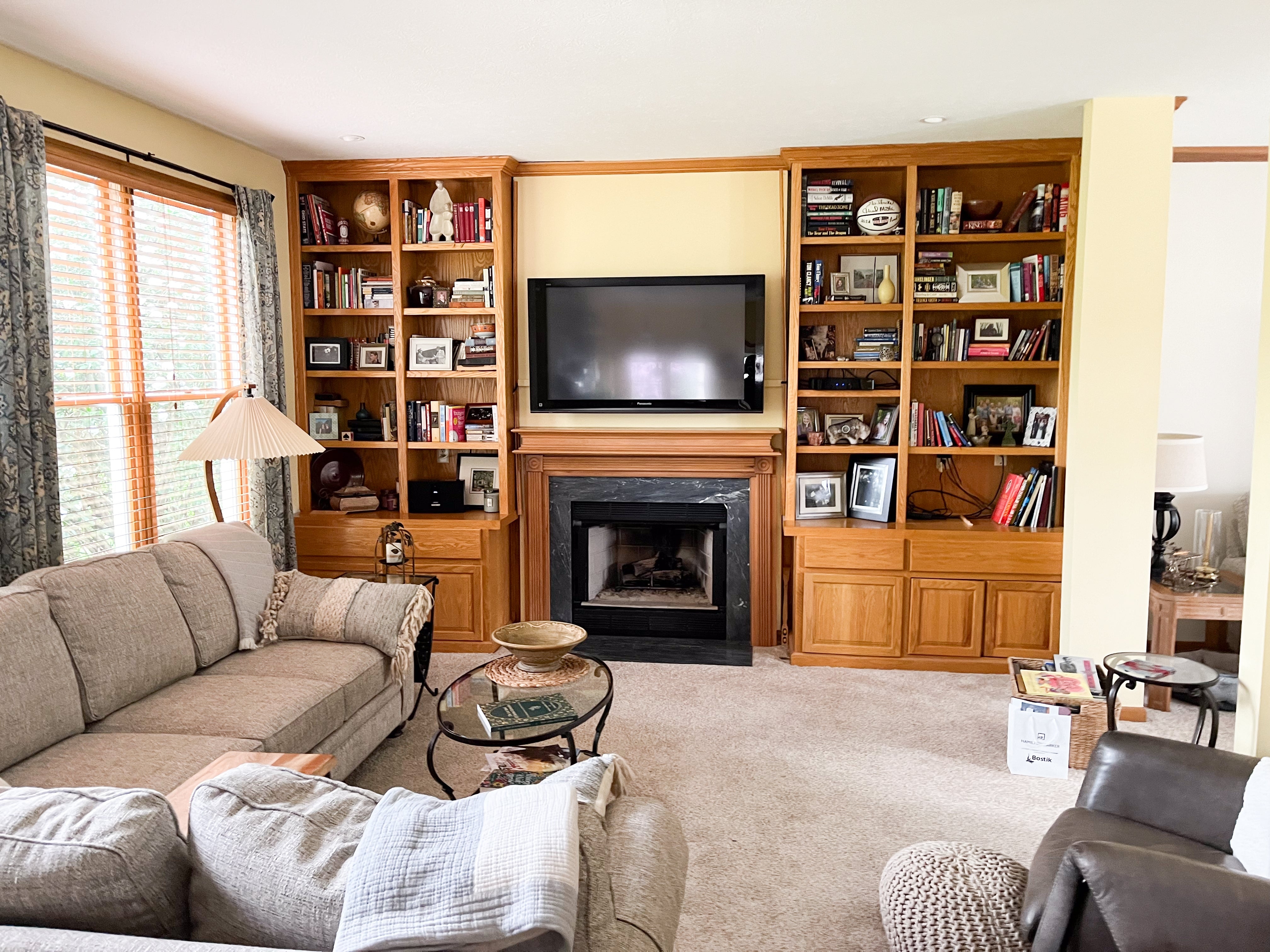 Built-In Bookcase: Warm Oak with Fireplace Hearth Integration