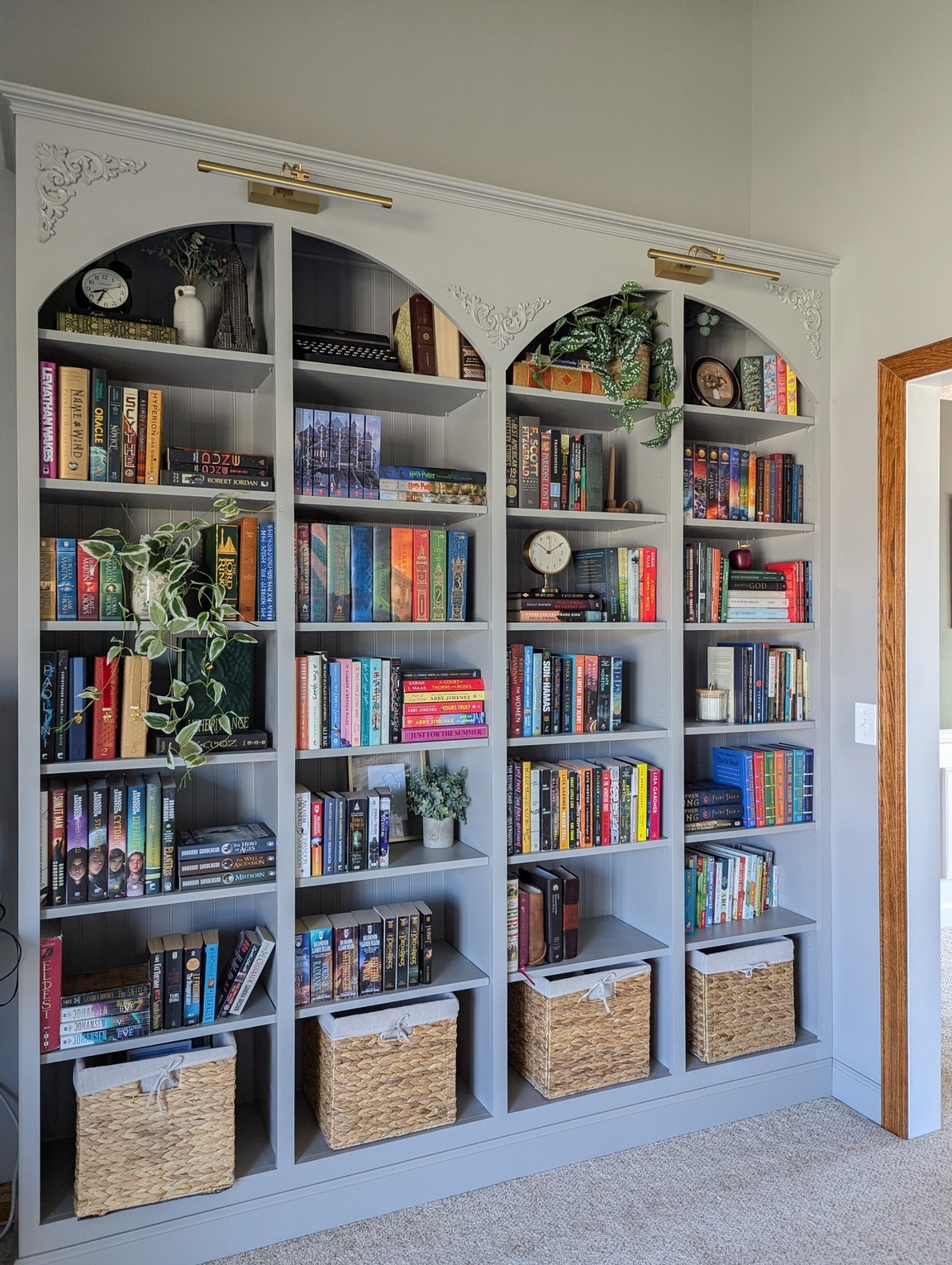 Built-In Bookshelf: Soft Gray Arched Niche with Brass Lights
