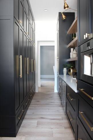 Butler's Pantry Matte Black Cabinetry and White Oak Floating Shelves