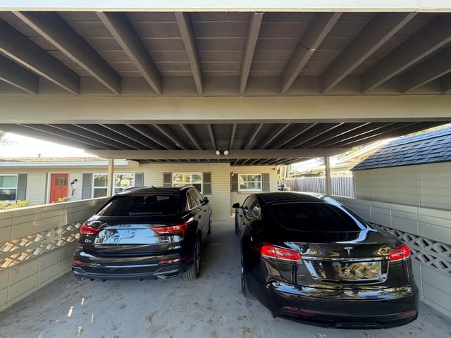 Carport with Exposed Joists and Decorative Block Wall Design