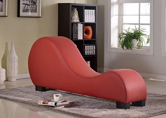 Chaise Lounge Featuring Vibrant Red S-Curve Frame and Ergonomic Shape