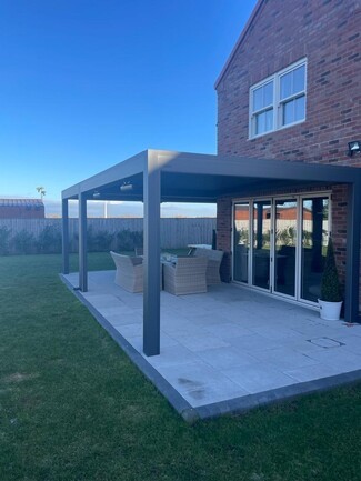 Charcoal L-Shaped Pergola Frame with Integrated Lighting