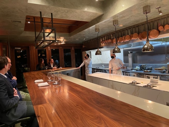Chefs Table Professional Kitchen Setting With Copper Pots