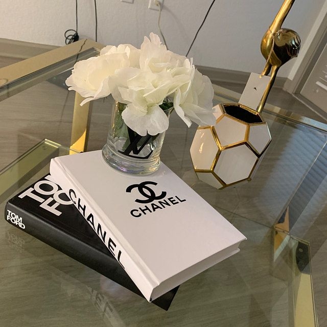 Coffee Table Decor with Designer Logo Branding and Gold Trim