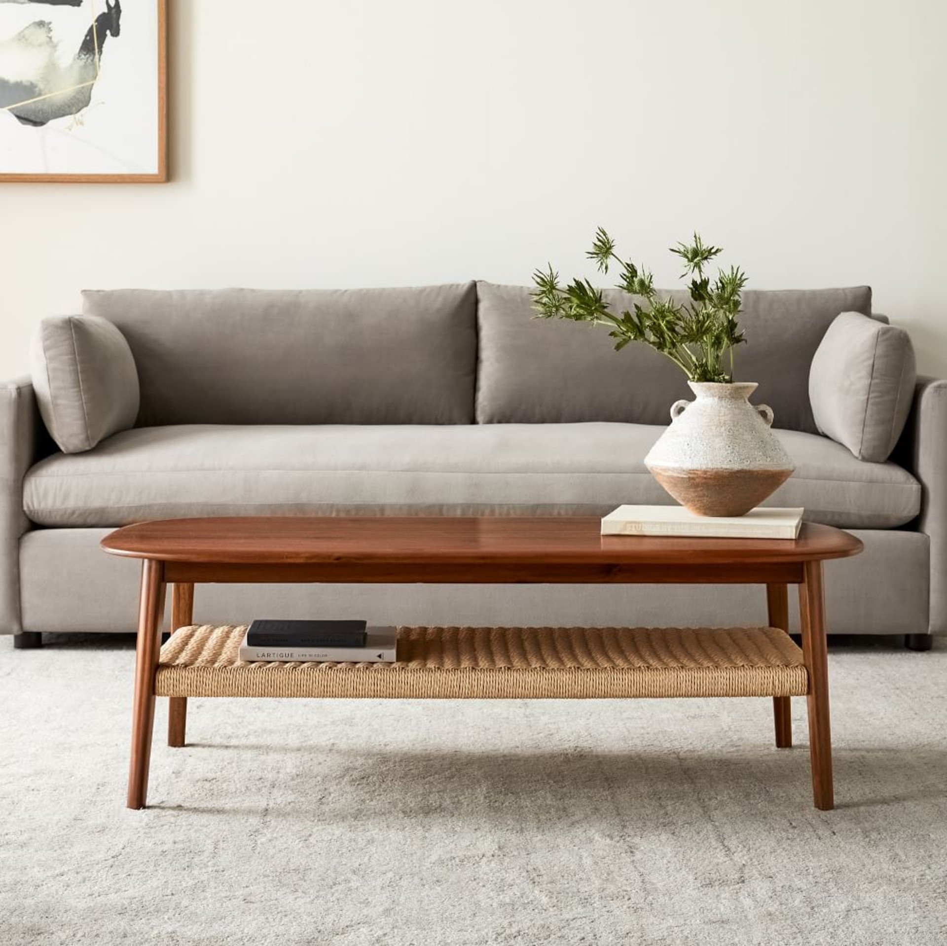 Coffee Table with Pill Shaped Top and Woven Lower Shelf