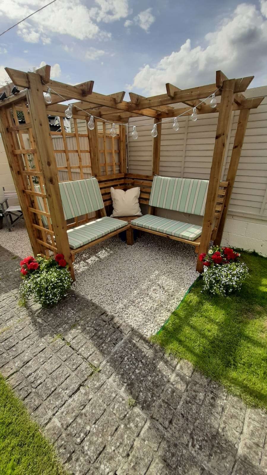 Corner Pergola L-Shaped Bench and Rustic Globe Lights