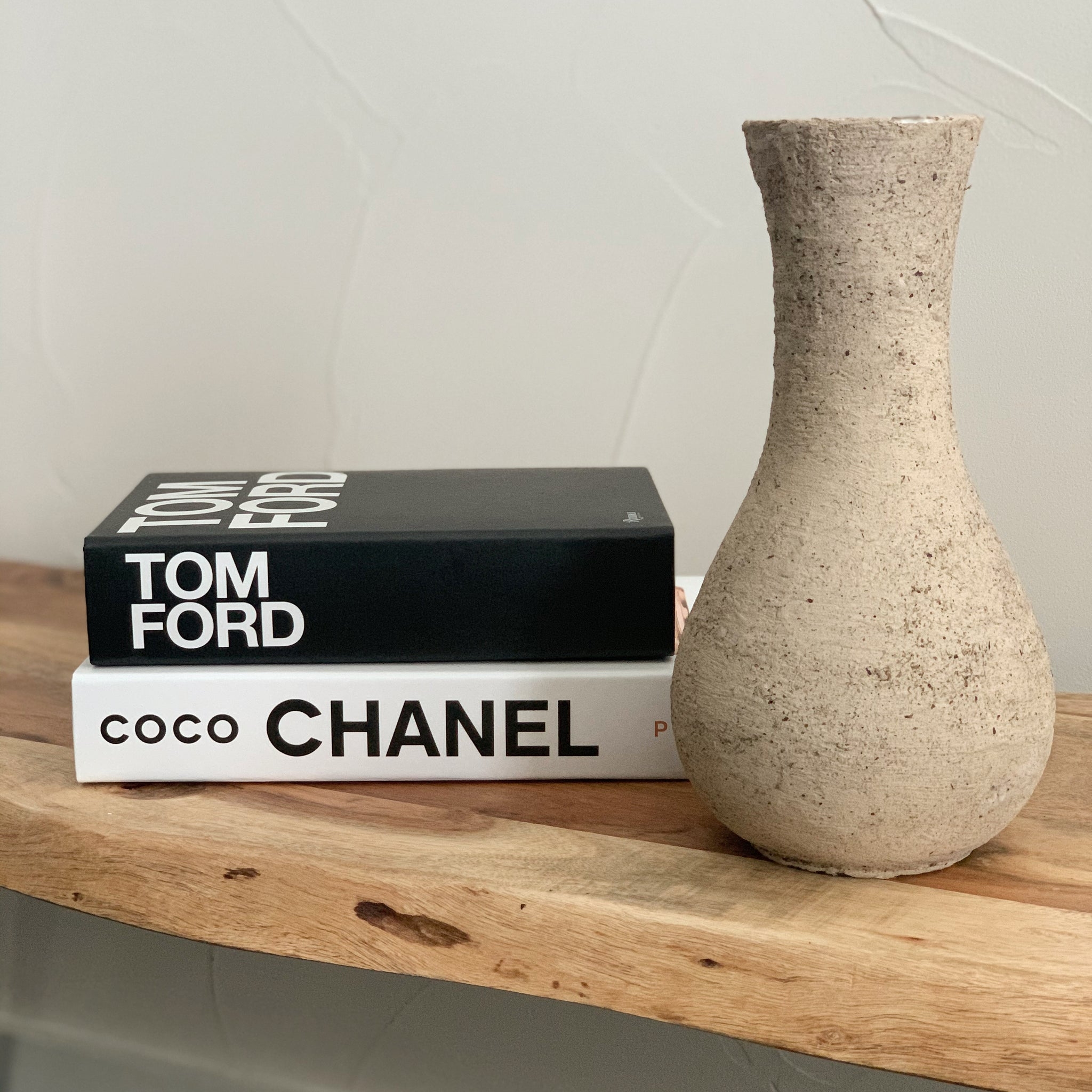 Decorative Books with Bold Typography and Grainy Texture Vase