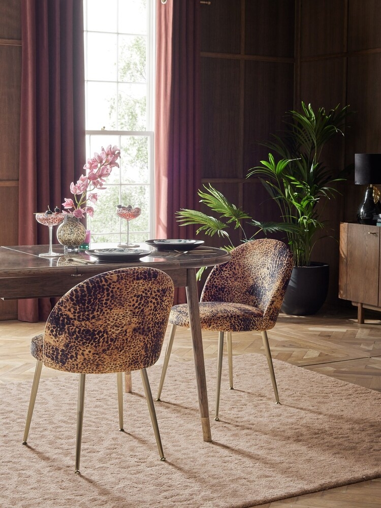 Dining Chair having Gold Legs and Leopard Scoop Back