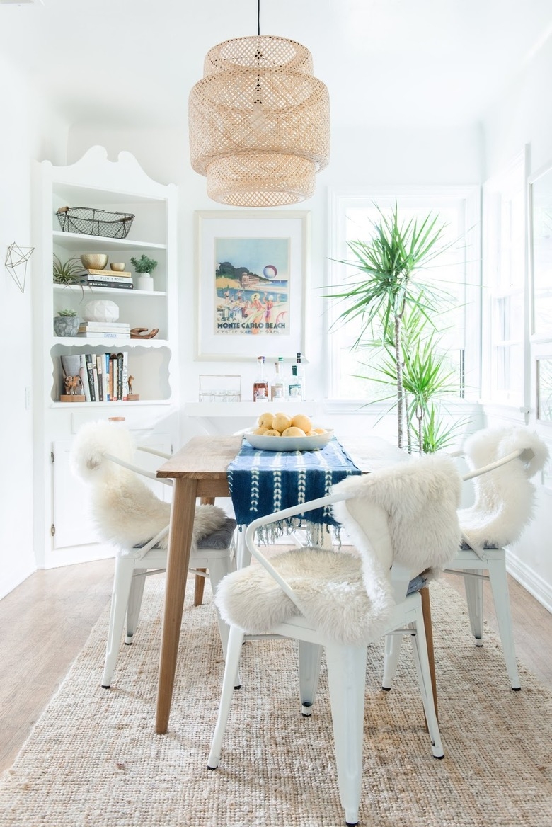 Dining Set with Sheepskin Draped Chairs and Tiered Pendant