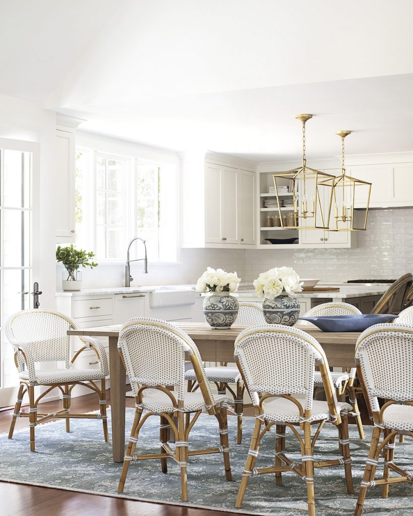 Dining Set with Woven Bistro Chairs and Gold Lantern Lighting