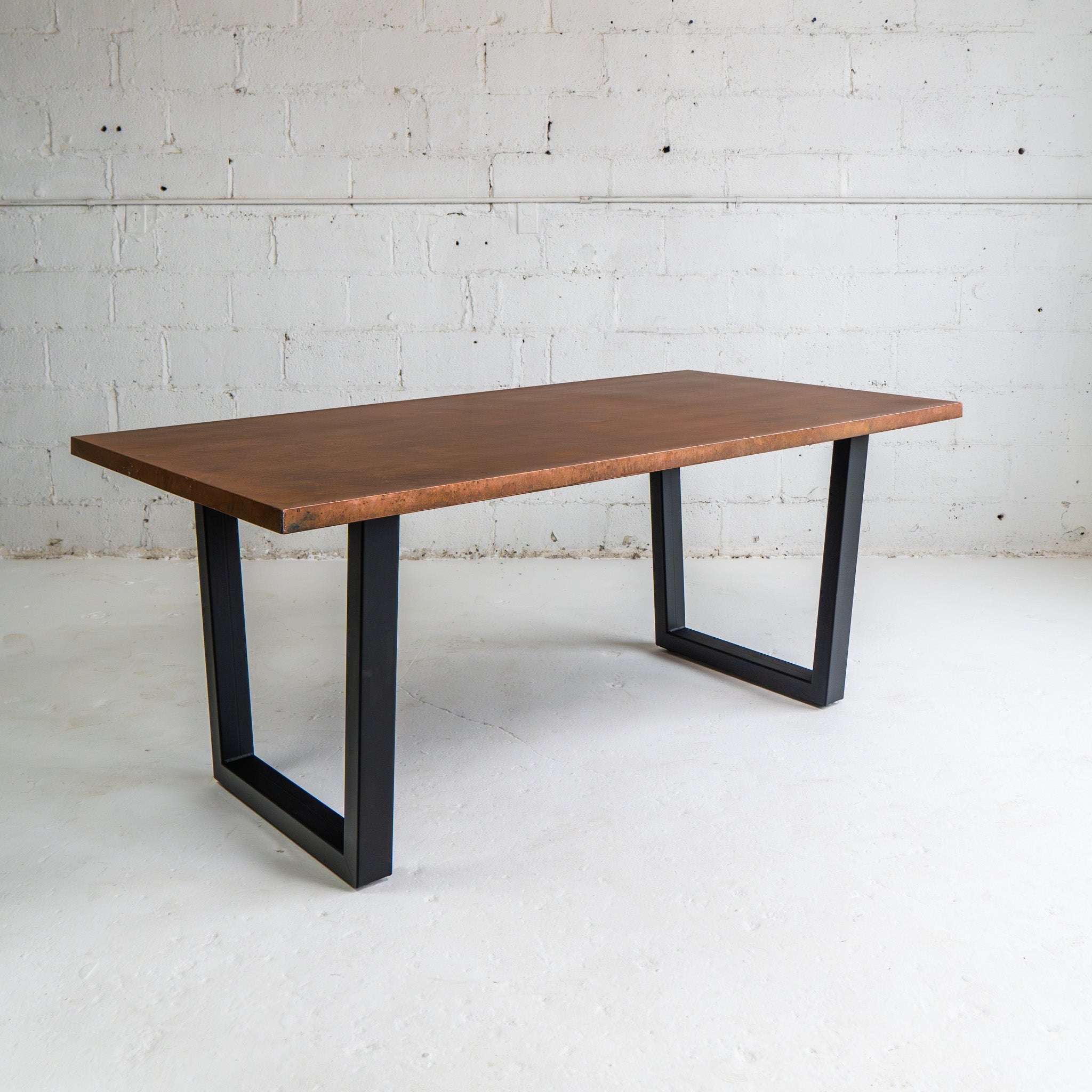 Dining Table: Modern U-Shaped Legs and Mottled Metal Top