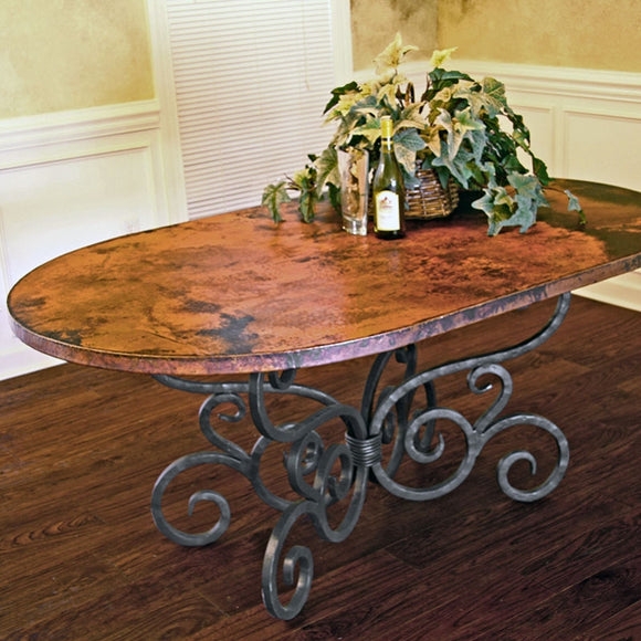 Dining Table: Soft Oval Shape and Forged Scroll Base