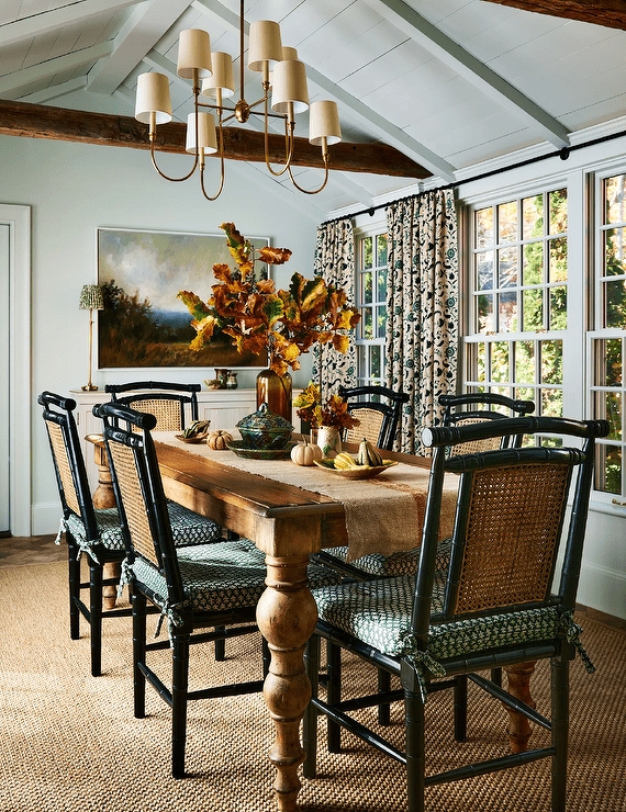 Dining Table with Faux Bamboo Chairs and Vaulted Ceiling Beams