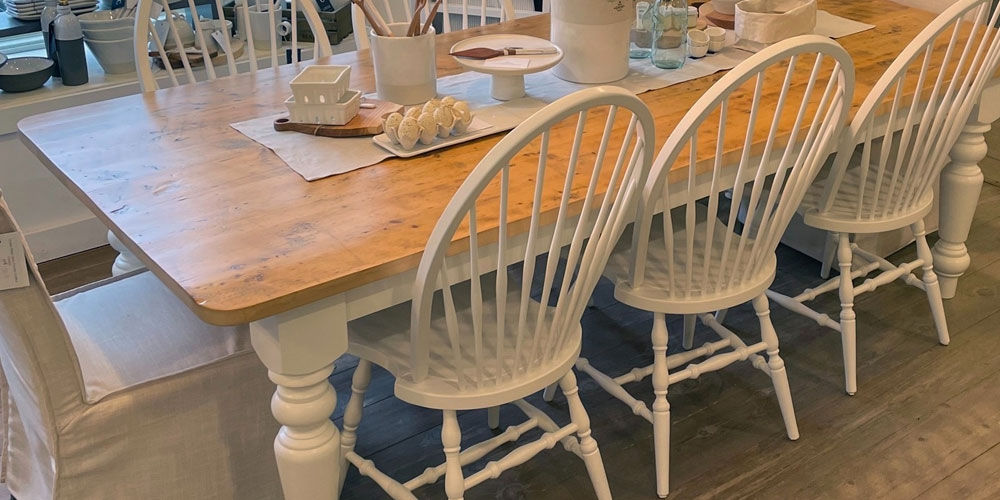 Dining Table with White Spindle Chairs and Rustic Wood Top