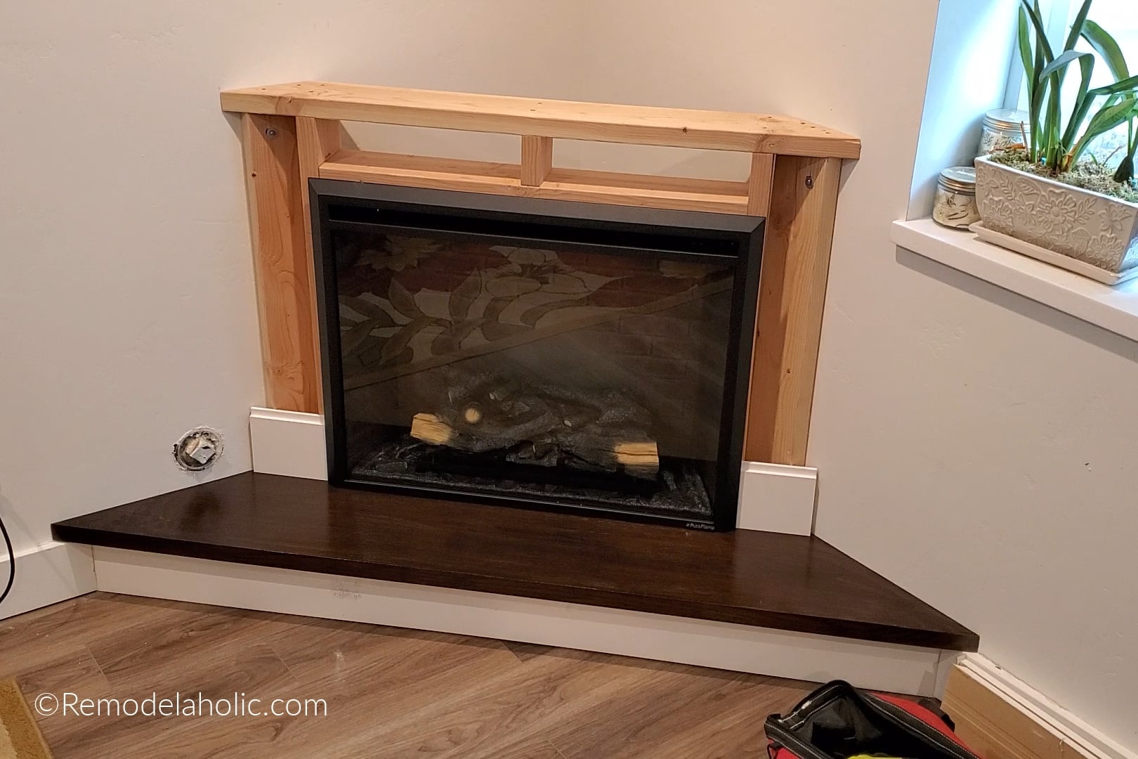 Electric Fireplace DIY Framing With Dark Wood Hearth