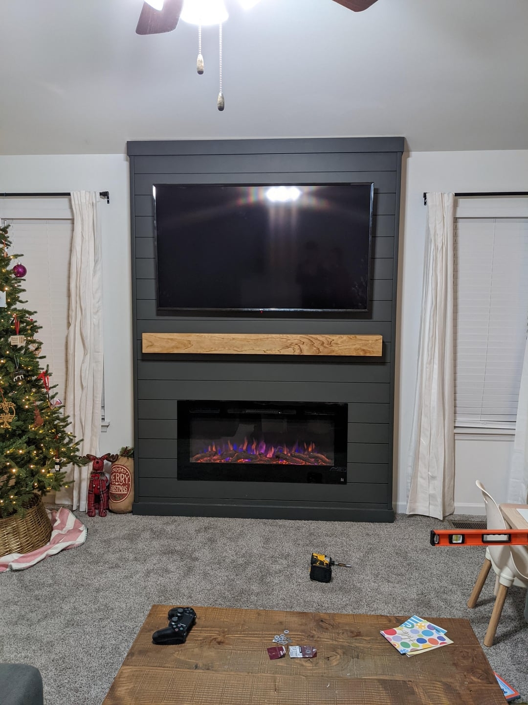 Electric Fireplace with Dark Shiplap Surround and TV