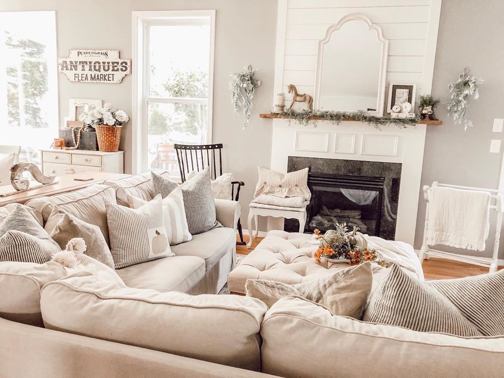 Farmhouse Living Room With Antique Signage Shiplap Mantel