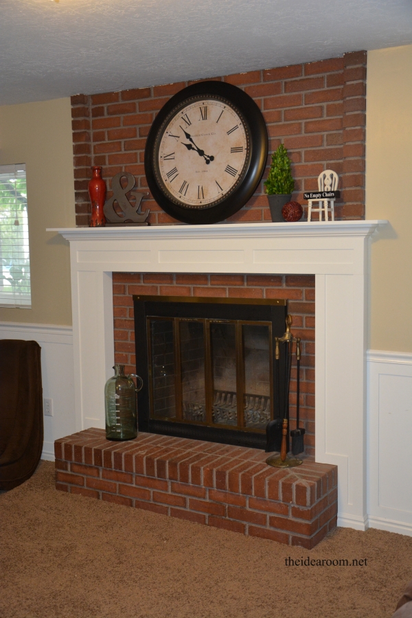 Fireplace Mantel With White Paneled Mantel and Oversized Clock