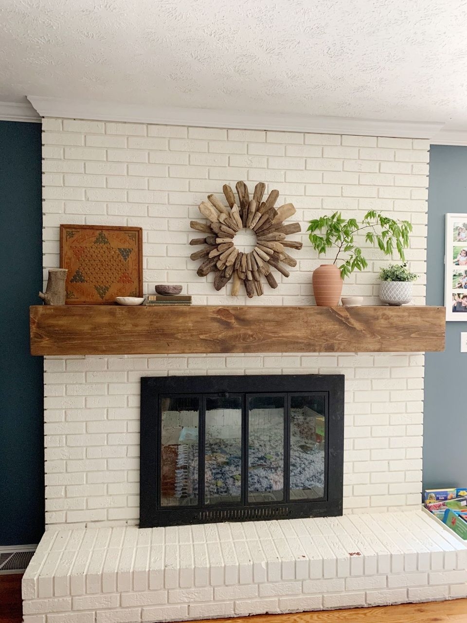 Fireplace Mantle With Thick Wood Beam and Driftwood Decor