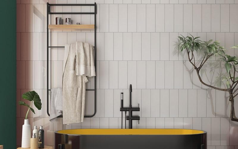 Freestanding Bathtub Yellow Interior and Vertical Tile Pattern