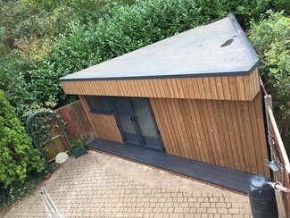 Garden Room: Hidden Storage and Anthracite Garden Doors Design