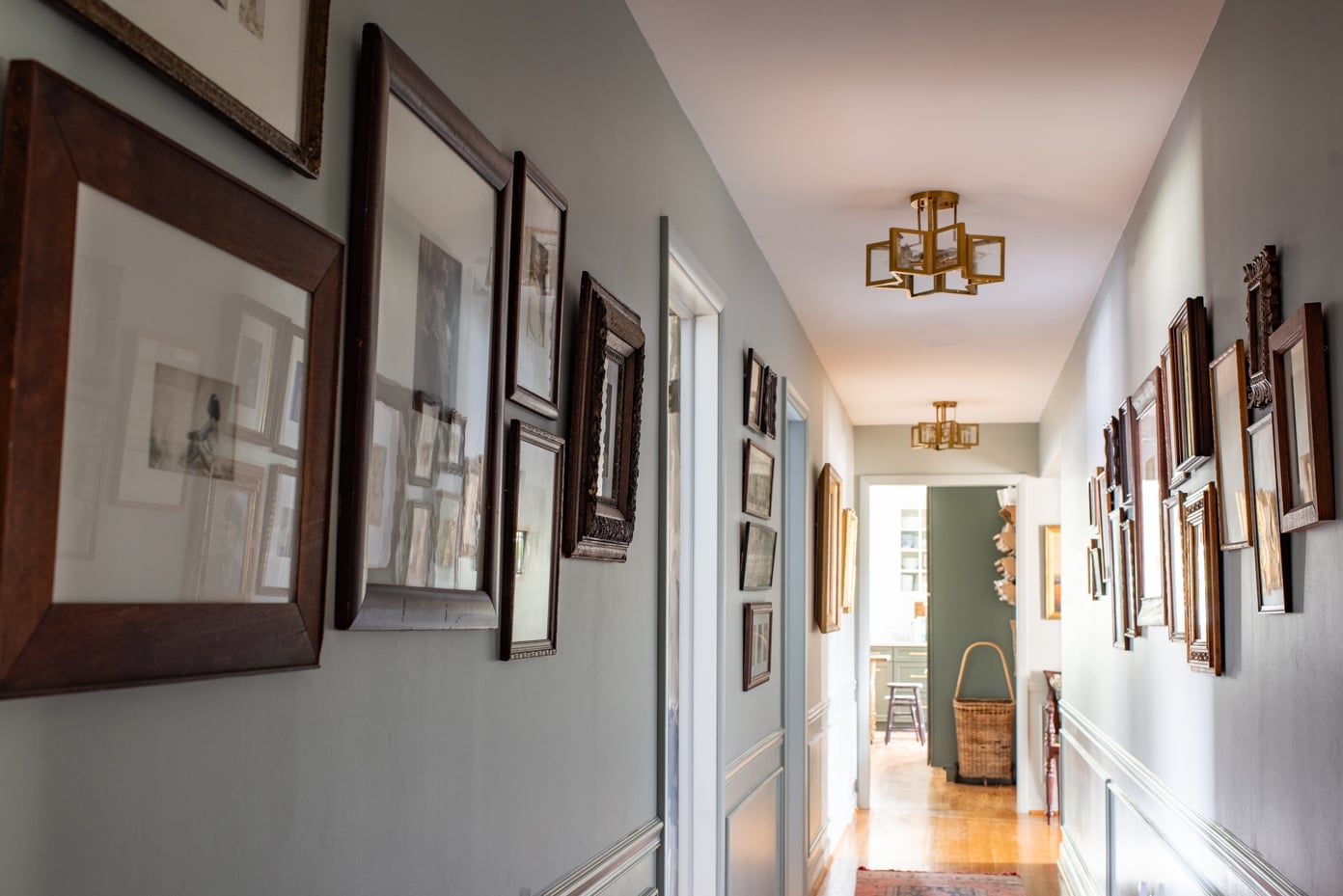 Hallway Gallery Gold Geometric Lights Muted Blue Walls
