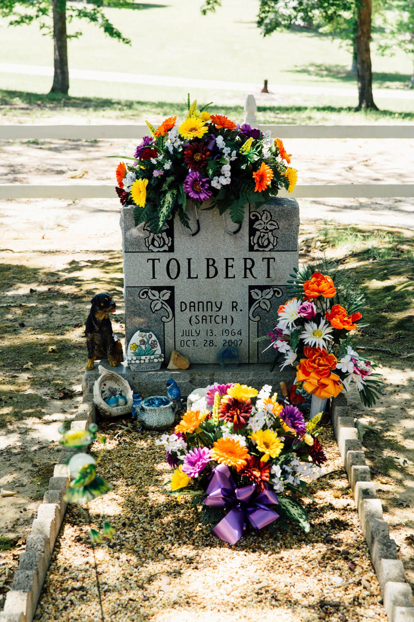 Headstone Scalloped Border and Vibrant Cemetery Floral Tribute