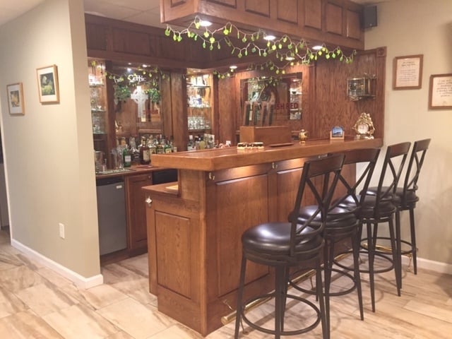 Home Bar featuring Integrated Soffit and Classic X-Back Stools