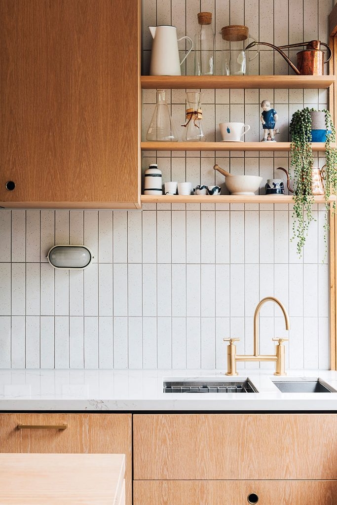 Kitchen Backsplash Gold Bridge Faucet and Vertical Tile Pattern