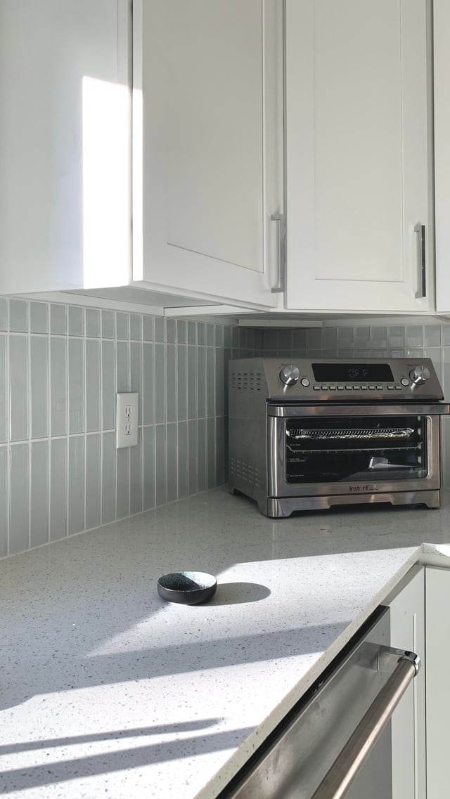 Kitchen Backsplash Pale Blue Hue and Speckled Quartz Style