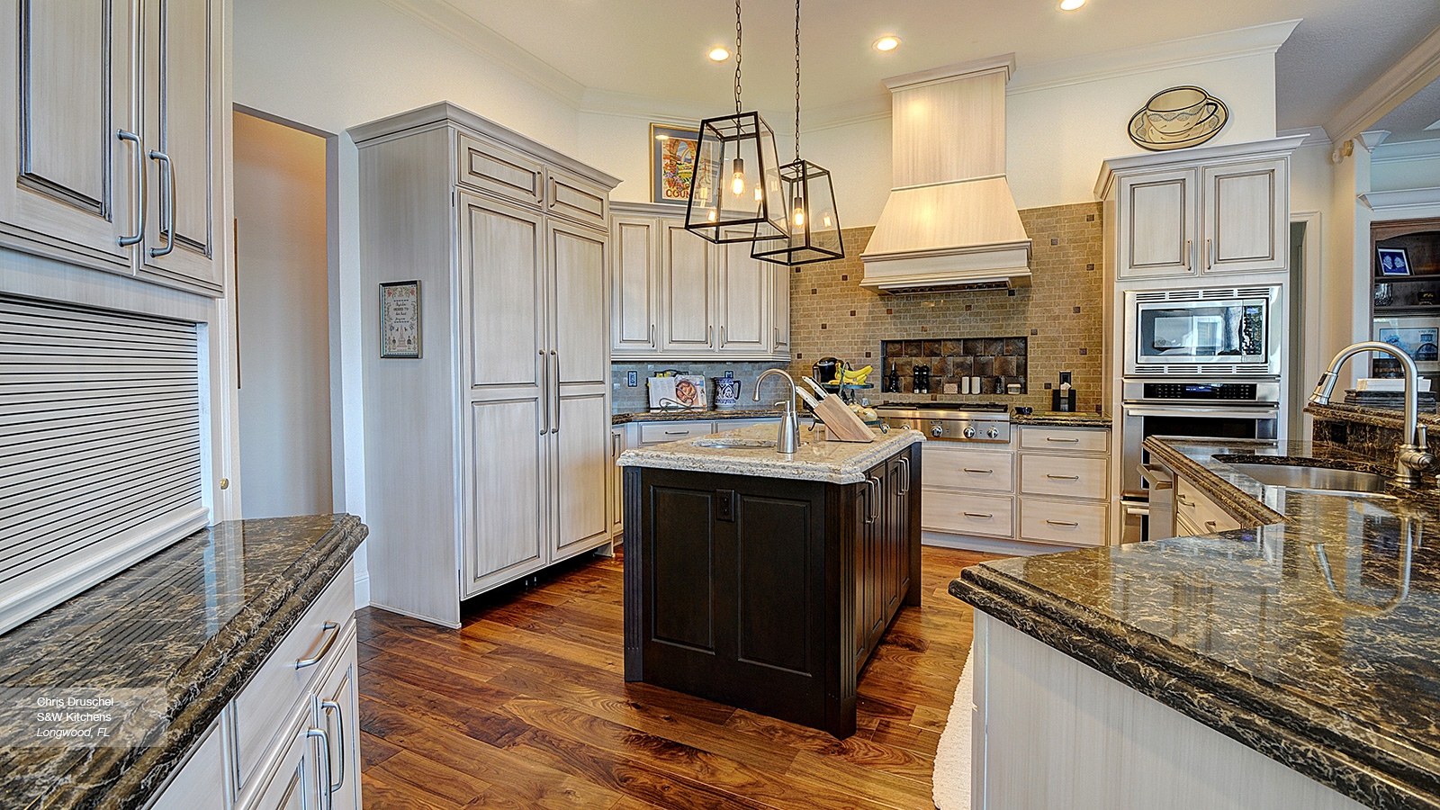 Kitchen Cabinetry with Off White Glaze and Cage Pendant Lights
