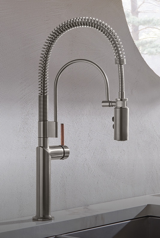 Kitchen Faucet: Coiled Spring Neck and Wood Lever Detail.