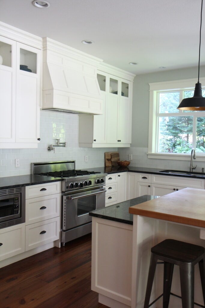 Kitchen Island with Butcher Block Top and Dark Granite Surface
